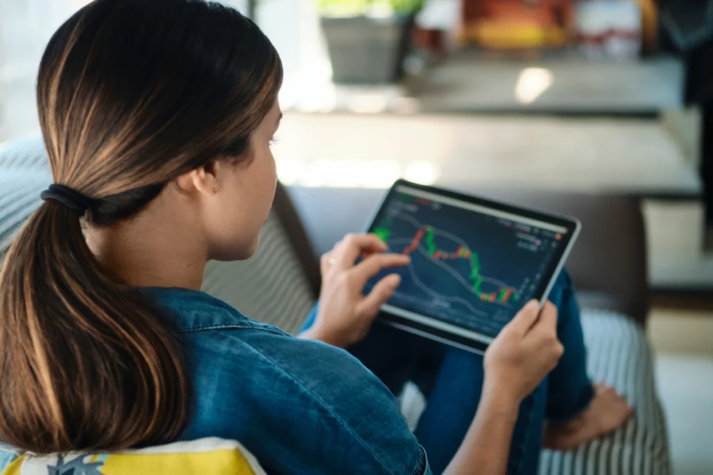 copy trader looking at trading chart on a mobile tablet