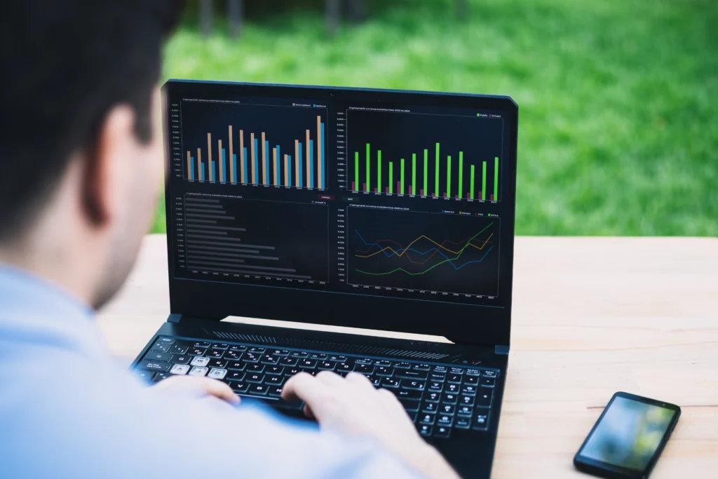 copy trader looking at trading signals on a copy trading platform on a laptop