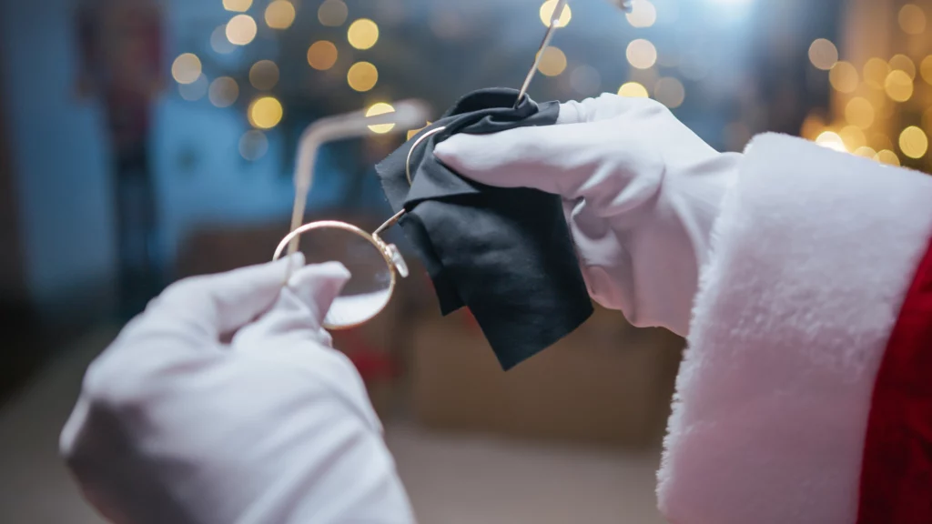 santa claus cleaning his glasses for stock market analysis