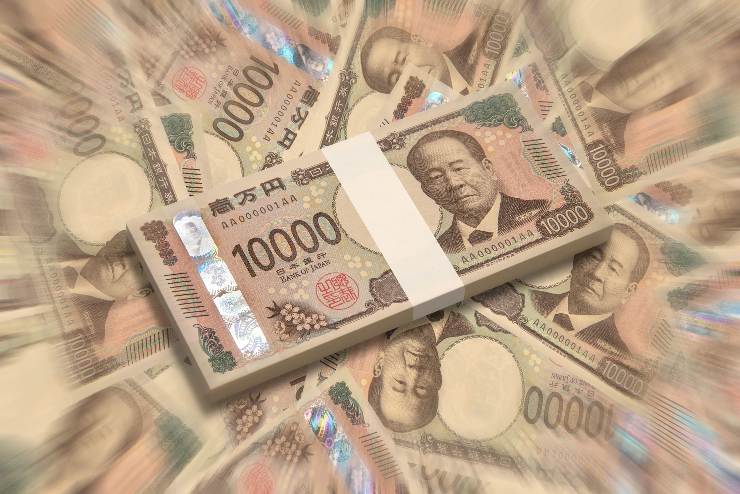 Bundles of Japanese yen banknotes (1000 and 10000 bills) stacked together, conveying wealth or money exchange.